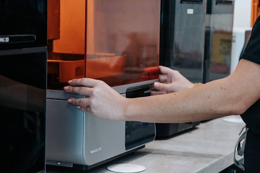 In-house 3D printer used to produce a dental restoration piece at White Clinic’s laboratory