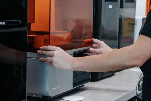 In-house 3D printer used to produce a dental restoration piece at White Clinic’s laboratory